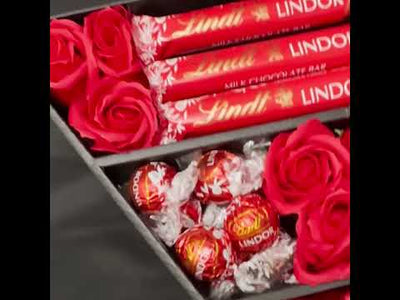 Video showing the Lindt Lindor chocolate bouquet with red roses hamper opens to show content lindor truffles lindor treat bar