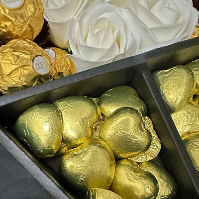 Ferrero Rocher Signature Chocolate Bouquet With Ivory Roses Close up shot of swiss milk chocolate hearts inside bouquet