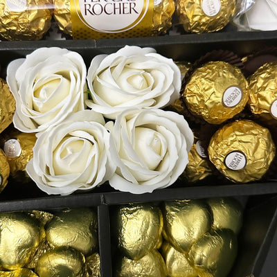 Ferrero Rocher Signature Chocolate Bouquet With Ivory Roses Close up shot of stunning roses with ferrero rocher chocolates