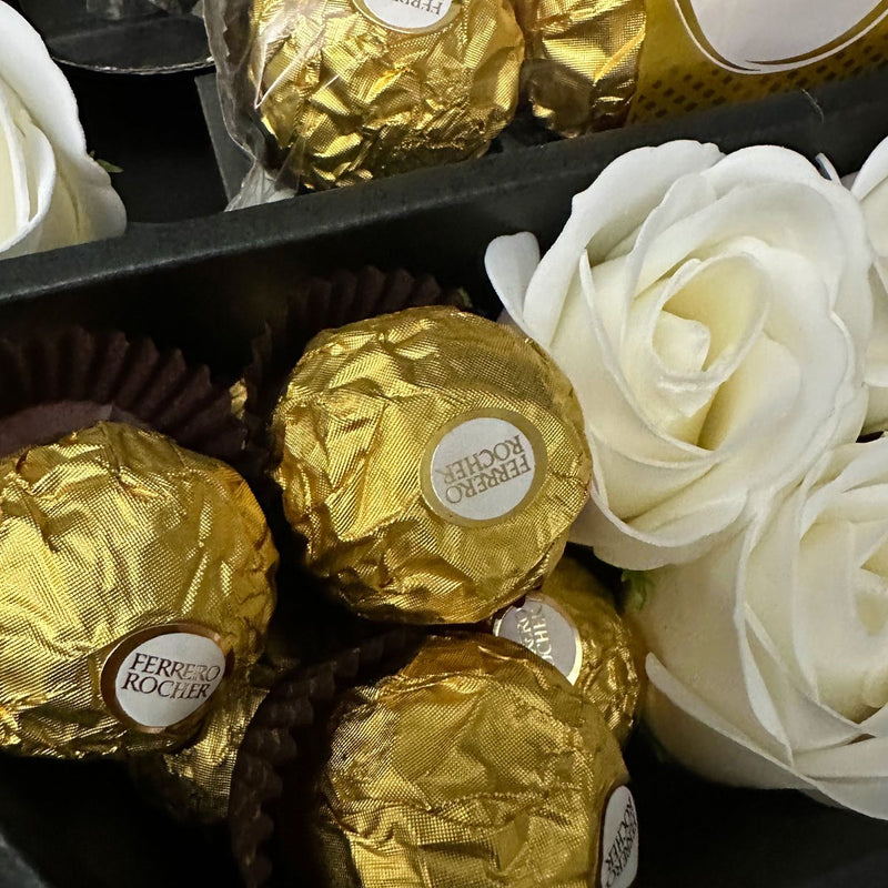 Ferrero Rocher Signature Chocolate Bouquet With Ivory Roses Close up shot of ferrero rocher chocolates with stunning roses
