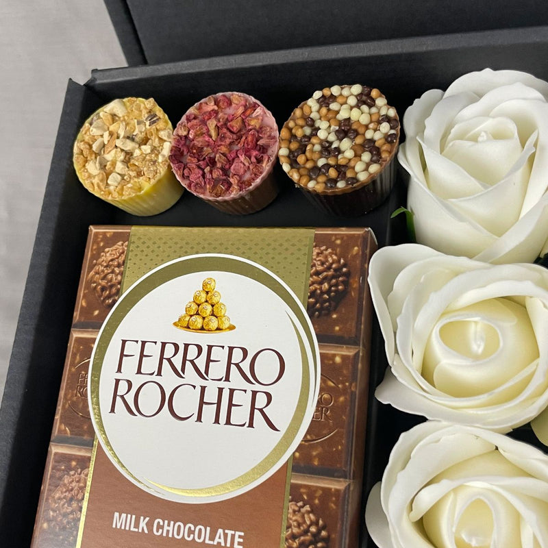 Ferrero Rocher Ultimate Gift Hamper With Ivory Roses close up of chocolate truffles and ferrero chocolate bar