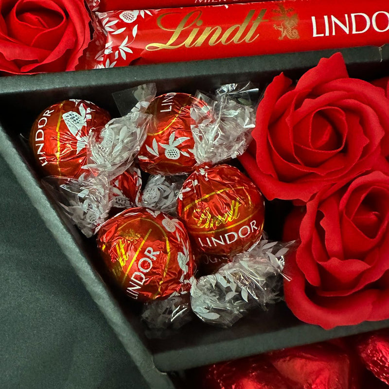 Close up of Lindt Lindor Chocolate Truffles inside a section of exclusive HamperWell signature chocolate bouquet packaging