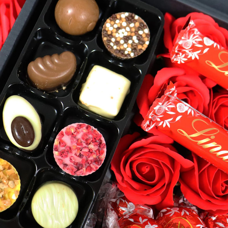 Lindt Lindor Ultimate Gift Hamper With Red Roses close up of handmade chocolate truffles and lindor bars