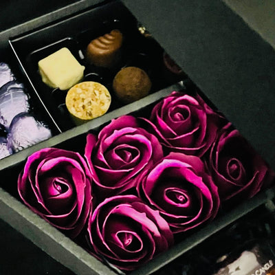 Cadbury Heroes & Yankee Candle Signature Chocolate Bouquet With Purple Roses close up of stunning purple roses