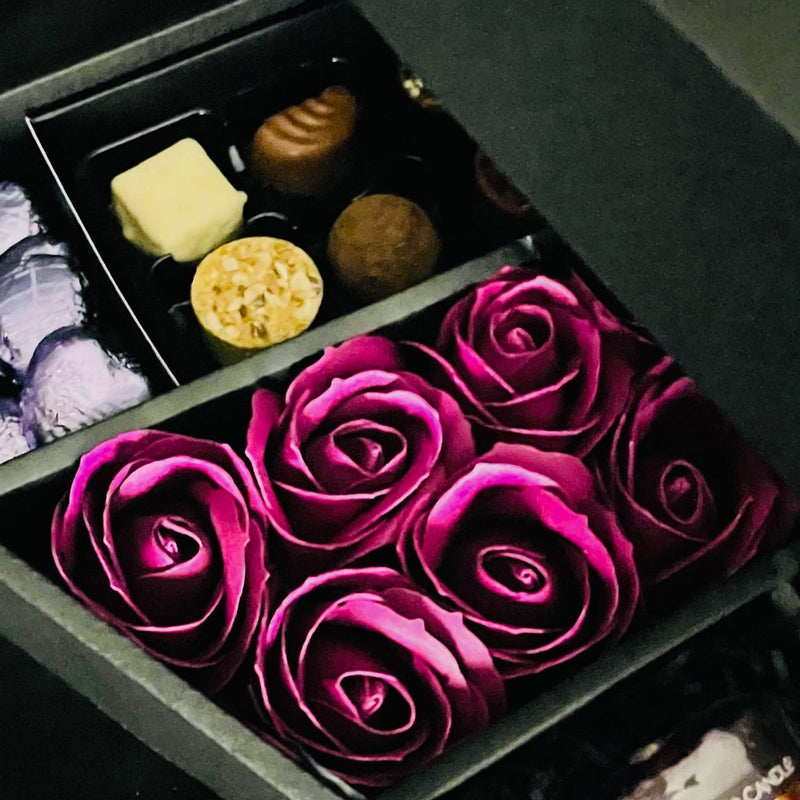Cadbury Heroes & Yankee Candle Signature Chocolate Bouquet With Purple Roses close up of stunning purple roses