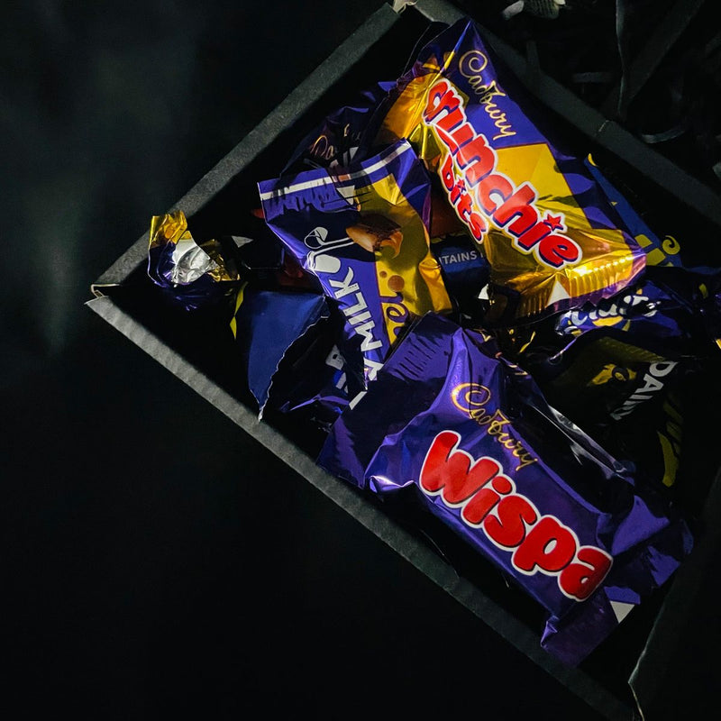 Cadbury Heroes & Yankee Candle Signature Chocolate Bouquet With Purple Roses, cadbury heroes in bottom section of bouquet