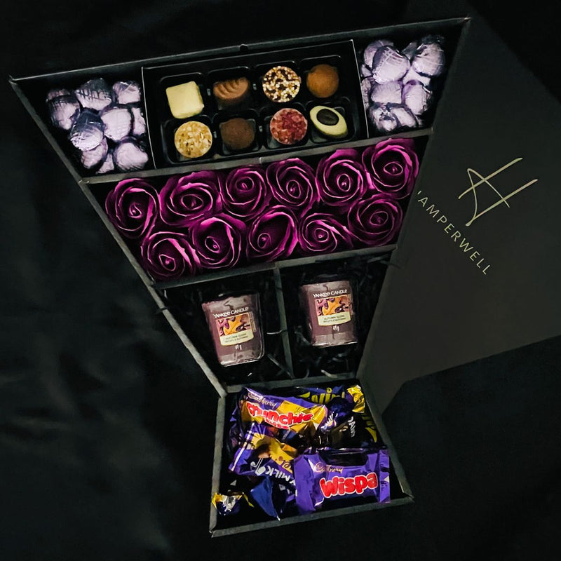 HamperWell Cadbury Heroes & Yankee Candle Signature Chocolate Bouquet With Purple Roses with Cadbury Heroes handmade truffles