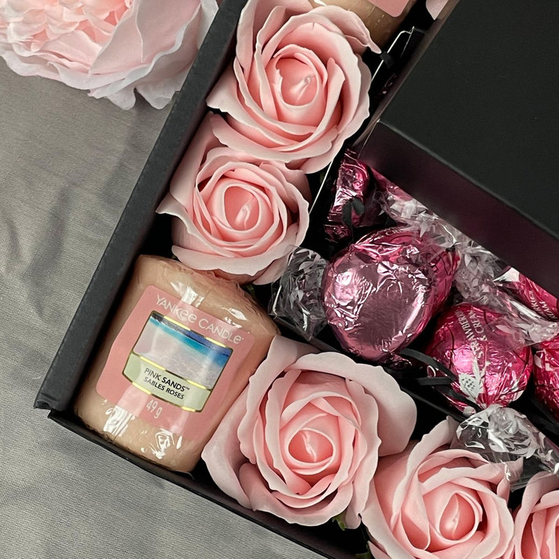 Yankee Candle Ultimate Gift Hamper With Pink Roses close up of yankee candle pink sands votive candles