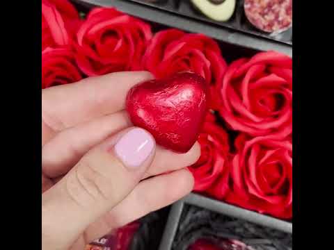 Video showing contents of HamperWell Lindt Lindor & Yankee Candle Chocolate Bouquet With Red Roses, Swiss chocolate hearts