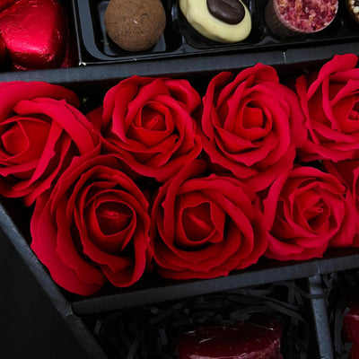 Stunning red roses of Lindt Lindor & Yankee Candle Signature Chocolate Bouquet With Red Roses inside chocolate bouquet box