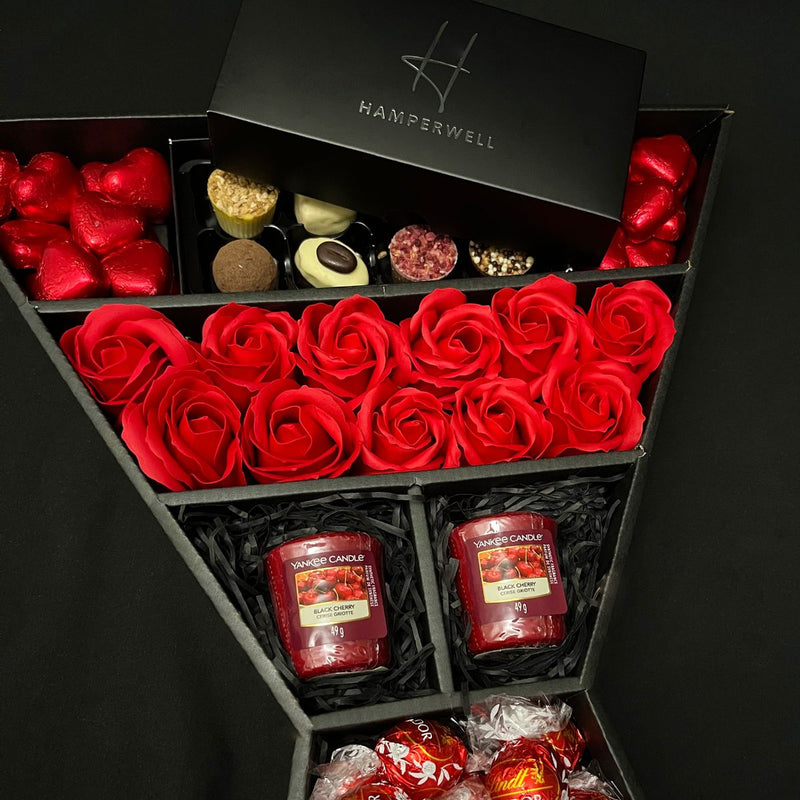 Top of Lindt Lindor & Yankee Candle Chocolate Bouquet With Red Roses exclusive to HamperWell, showing contents in packaging