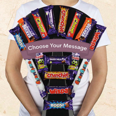 Treat a chocoholic to our delicious Cadbury Essentials Chocolate Bouquet. This chocolate bouquet is packed with delicious Cadbury treats including Crunchie, Boost, Dairy Milk, Wispa and lots more. This trophy display of Cadbury chocolate makes a great gift for all celebrations. 